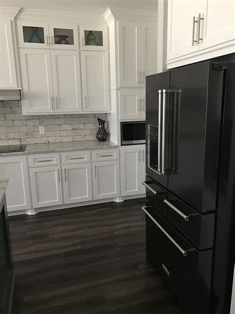 kitchens with black stainless steel appliances and white cabinets|black and white kitchen appliances.